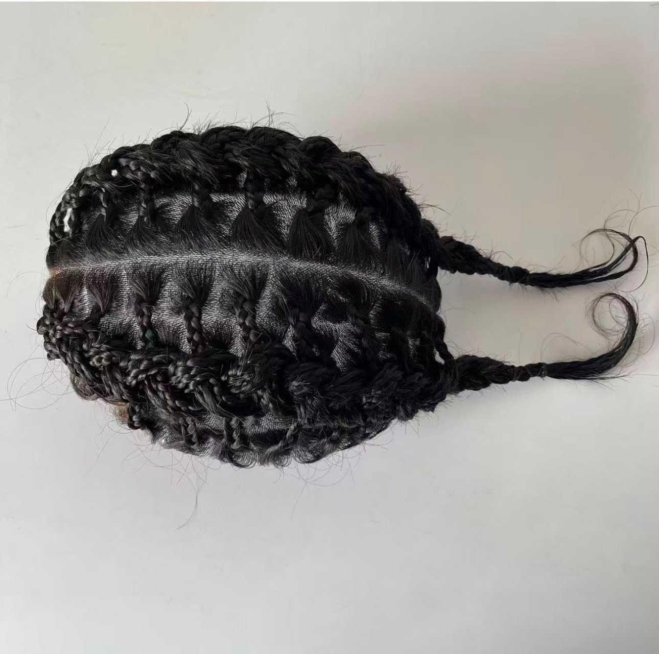 OMB Braided Hair System — overhead view showing intricate box braid pattern and lace base