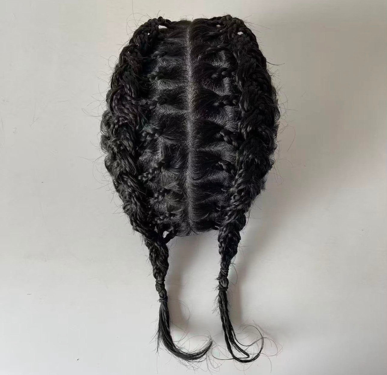 OMB Braided Hair System — rear view showing full box braid coverage and dual braided tails
